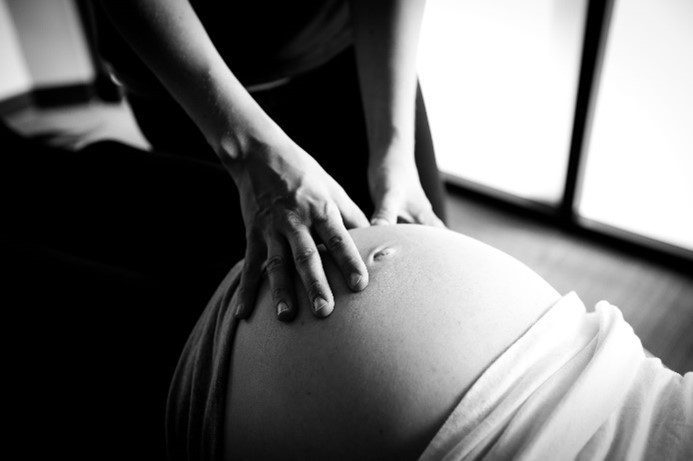 Fort Worth area Chiropractor using Webster Technique to perform prenatal chiropractic adjustment